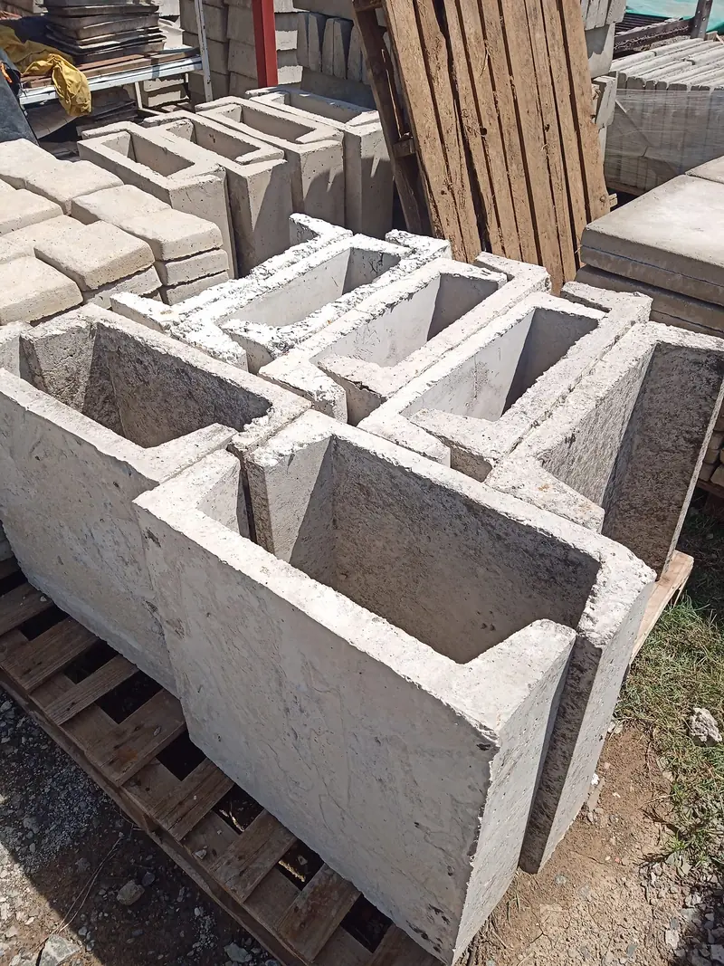 Precast concrete rain channels stacked on a pallet