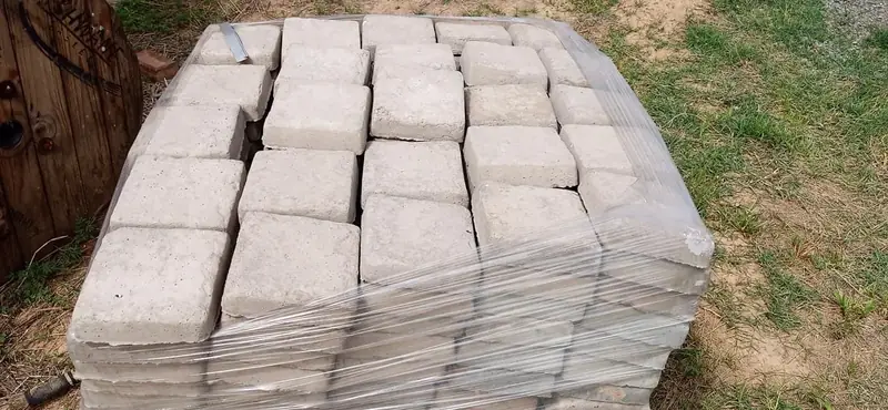 Pallet of precast concrete stepping stones wrapped for delivery