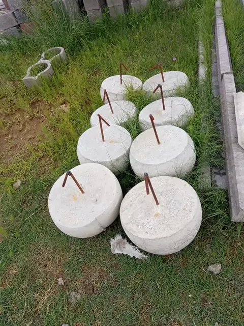 Round precast concrete traffic calming domes with steel anchor pins